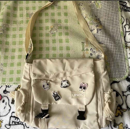 Medium size shoulder bag with pins