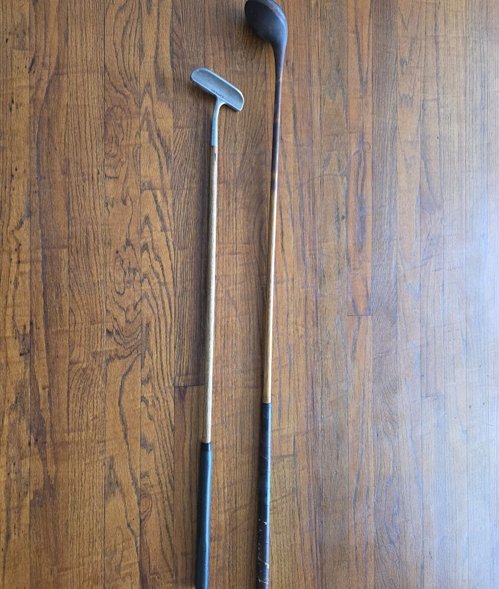 Vintage wood driver and putter.
